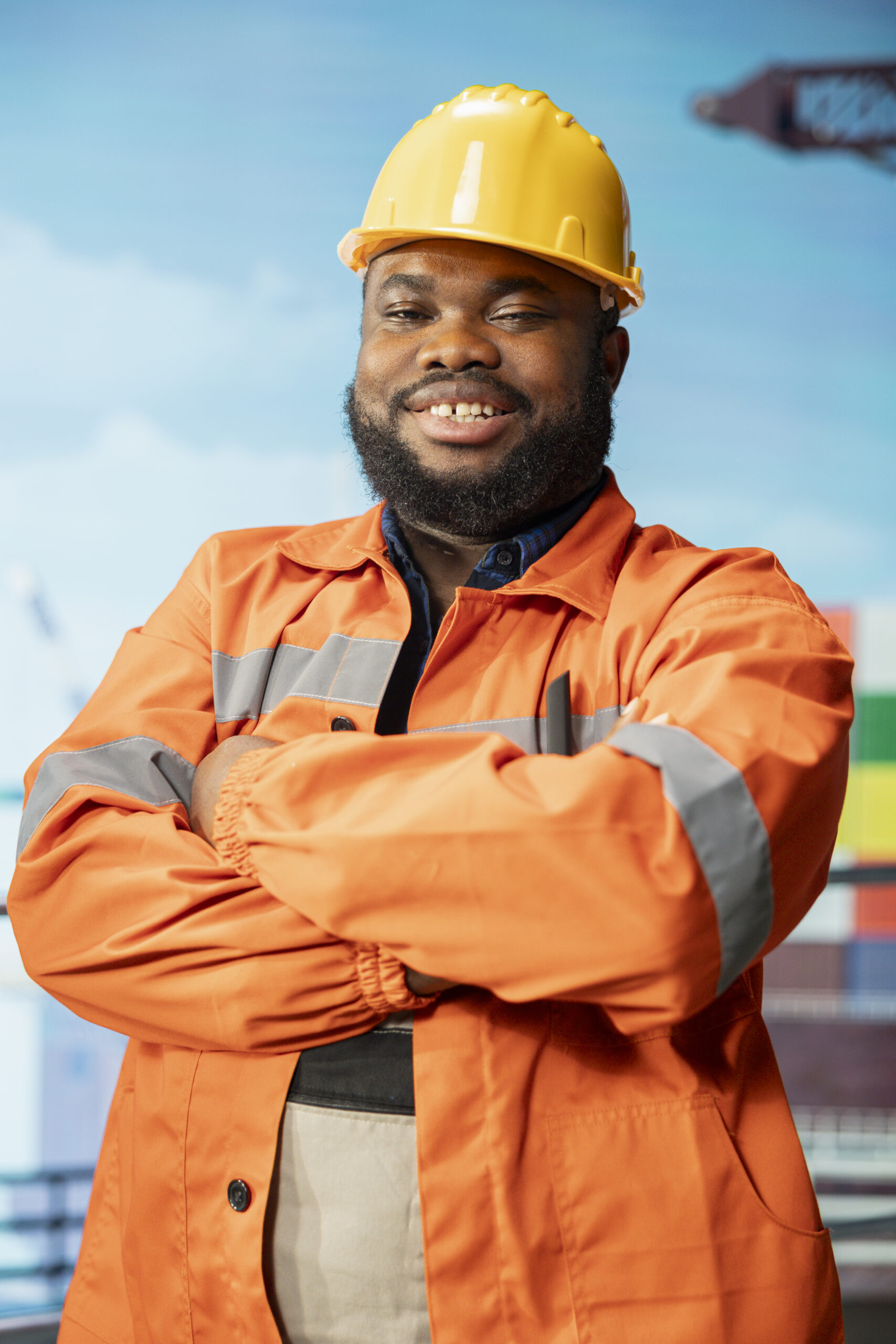 portrait of smiling offshore rig employee monitoring operations